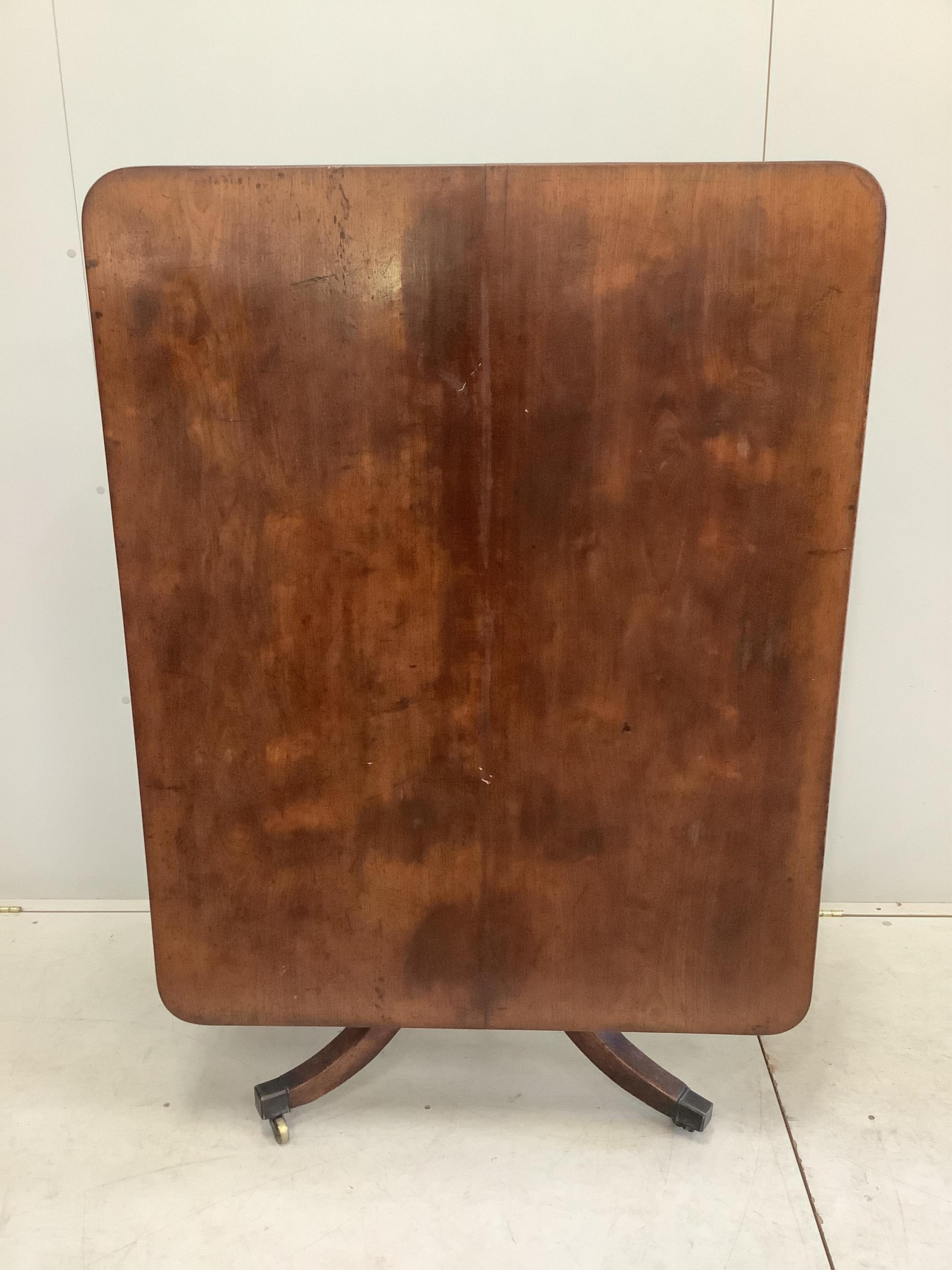 A Regency rectangular mahogany tilt top dining table, width 121cm, depth 97cm, height 70cm. Condition - fair